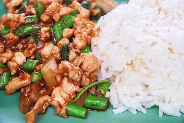 istock Stir fried chicken with holy basil with rice on plate 1168101598