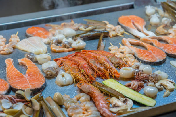 istock Various kind of delicious seafood on grilling pan in restaurant 1168102355