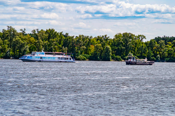 istock White pleasure boat floats on the river river. 1168105394