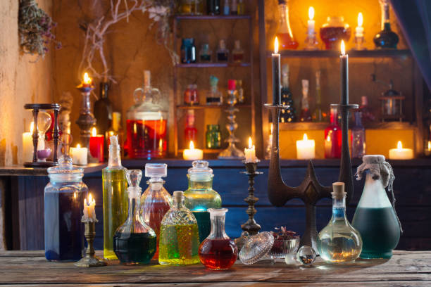 istock magic potions in bottles on wooden background 1168105418