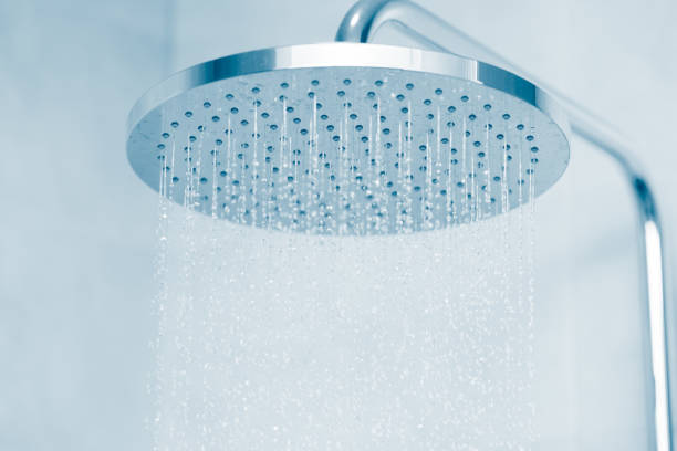 rain water falling type shower head with blue clean tone - contemporary indoors lifestyles domestic room imagens e fotografias de stock