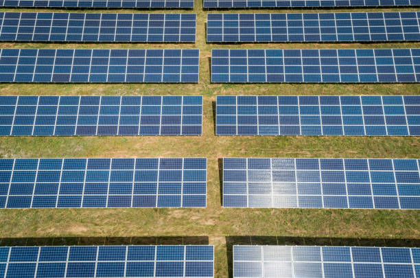 istock Aerial top view of a sun lit solar panels 1168111606