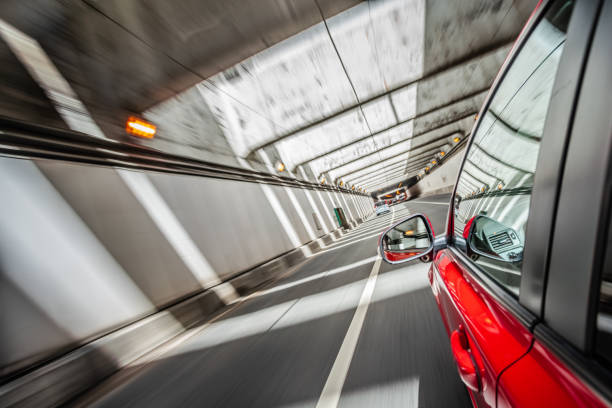 Driving a red car in the urban tunnel