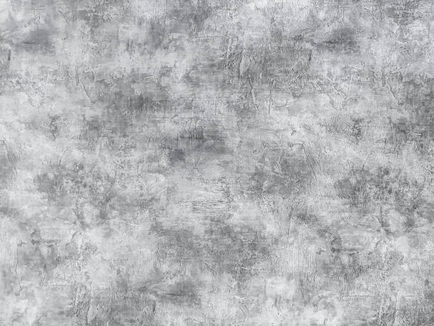 istock Old gray wall covered with uneven plaster. Texture of vintage shabby silver stone surface, closeup. 1168114200