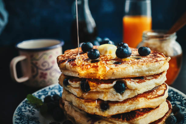 istock Stack of Pancakes with Maple Syrup and Fresh Blueberries 1168118551