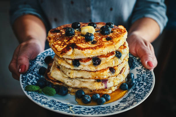 istock Stack of Pancakes with Maple Syrup and Fresh Blueberries 1168118555