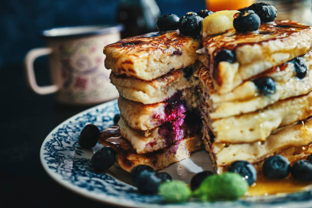 istock Stack of Pancakes with Maple Syrup and Fresh Blueberries 1168118558