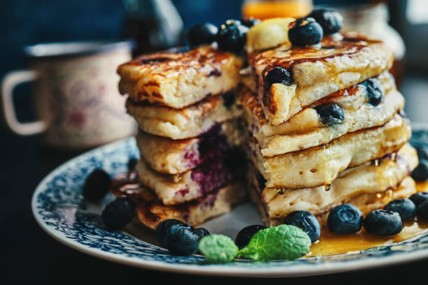 istock Stack of Pancakes with Maple Syrup and Fresh Blueberries 1168118559