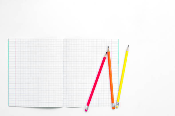 istock Blank notebook and pencils on white background. School supplies. White sketch book with colourful pencils. Note book and pencil 1168118970