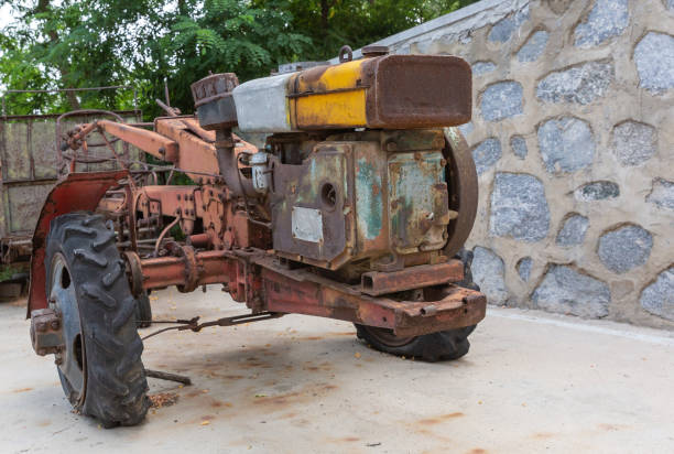 istock Outdoor scrapped rusty Chinese style walking tractor wreck 1168119593