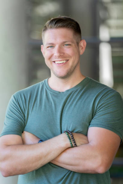 istock Confident man smiles for portrait outdoors 1168121470