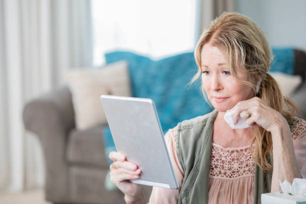 istock Senior patient is describing her flu symptoms to her doctor while using a digital tablet 1168123424