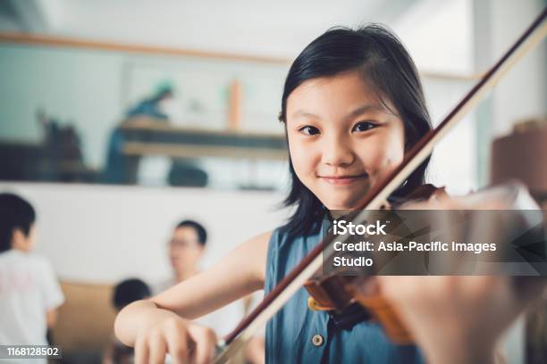 Asian Little Girl Playing Violin At Home Stock Photo - Download Image Now - Music, Playing, Playful