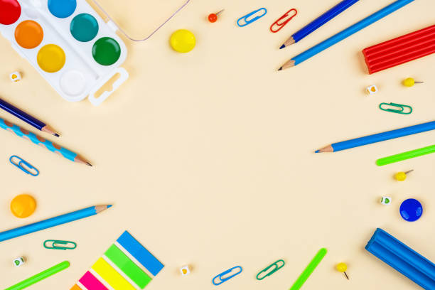 istock School accessories on a yellow background. Pastel colored. 1168129939