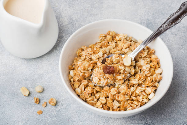 istock Healthy breakfast. Fresh granola, muesli with yogurt on grey background. Copy space 1168130129
