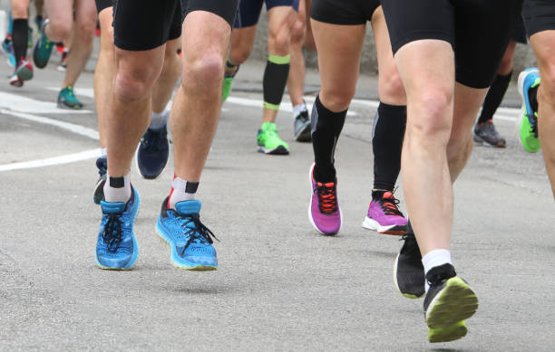 istock athletes participate in a road marathon 1168130252