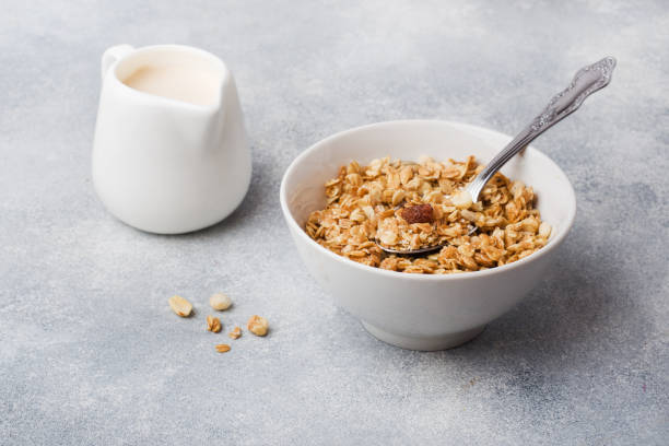 istock Healthy breakfast. Fresh granola, muesli with yogurt on grey background. Copy space 1168130435