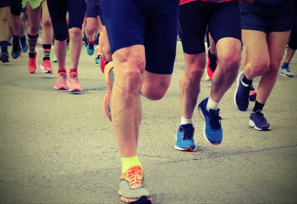 istock legs of many runners during a race 1168131752