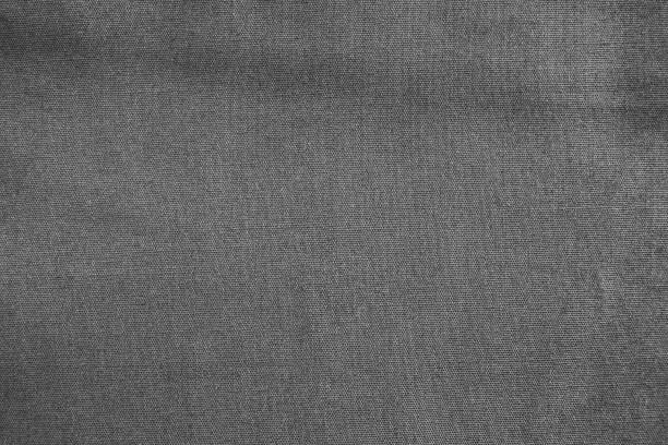 istock Closeup black crumpled cotton fabric texture background. 1168135357