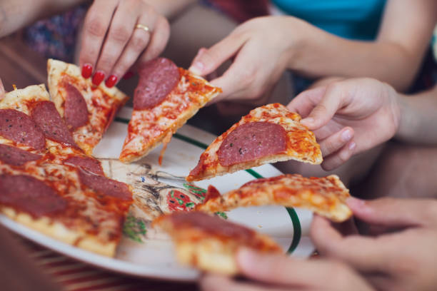 istock Family Pizza Party 1168135479