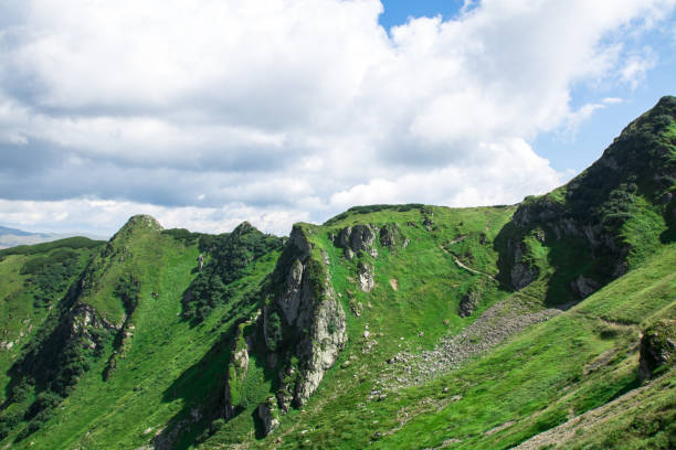 istock green mountain alps ridge, low gray clouds 1168136195