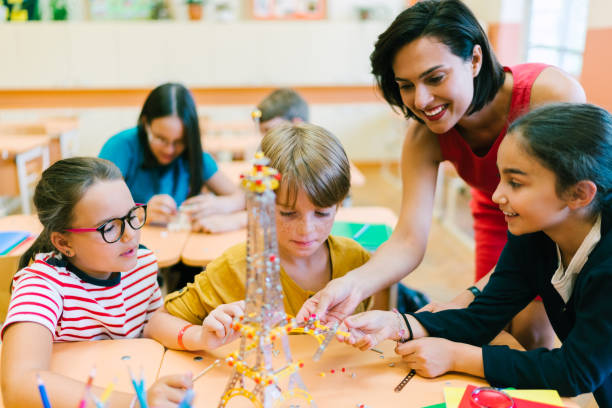 istock School children with teacher in class 1168138042