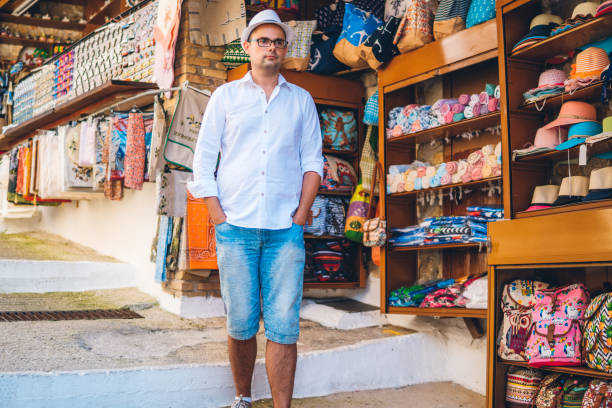 istock Tourist man in street market 1168138043