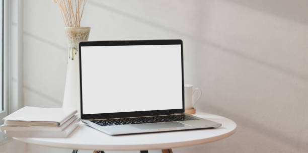 istock Blank screen laptop in minimal home-office with books and vase 1168139062