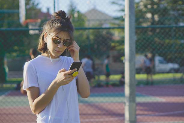istock Listening music in public park 1168139912