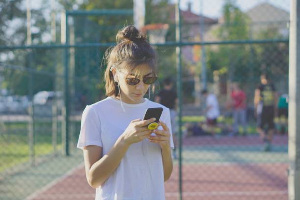 istock Listening music in public park 1168139987