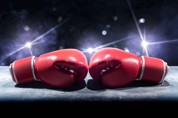 istock Pair of red boxing gloves on the table 1168146903