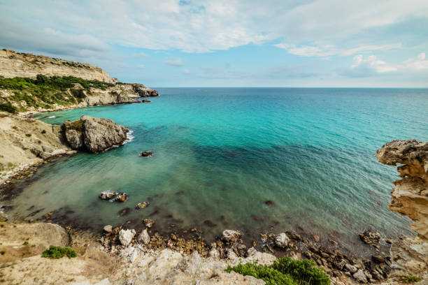 istock Beautiful sunny summer day on the rocky coast 1168149021