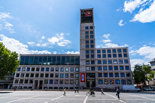 Stuttgart, Germany, August 14, 2019, Modern town hall building at market place downtown called marktplatz with many people walking over the square enjoying hot summer day