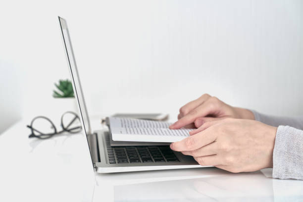 istock Woman searching information in book, Office Work Concept on white wall background 1168149717