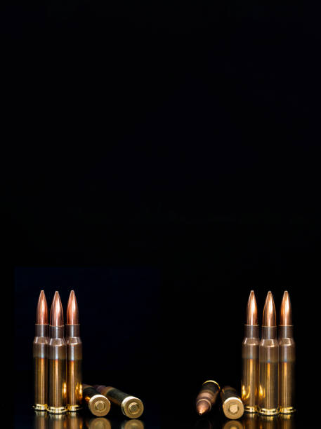istock Bullet isolated on black background with reflexion. Rifle bullets close-up on black back. Cartridges for rifle and carbine on a black. 1168151247