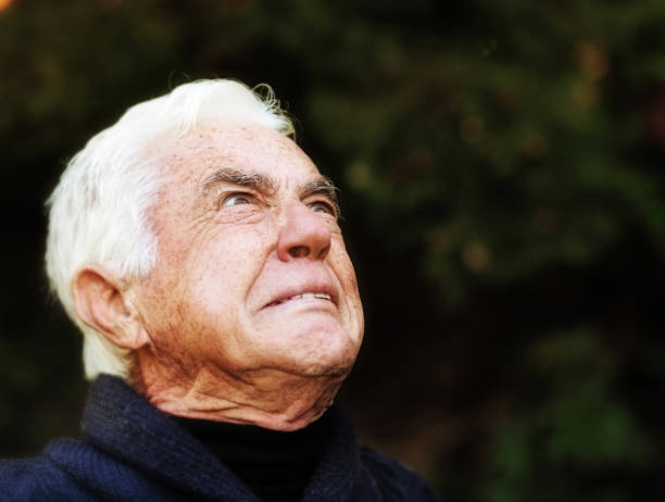 istock Senior man looks up, grimacing in horror or disgust 1168152197