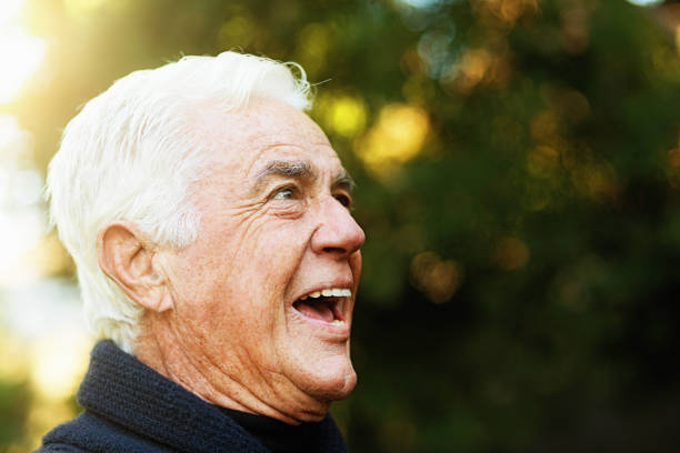 istock Senior man looks sideways, mouth open either smiling or startled 1168153682