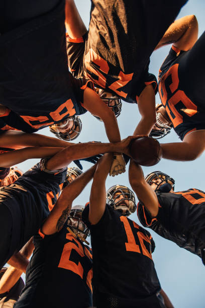 istock Football players unity 1168153828