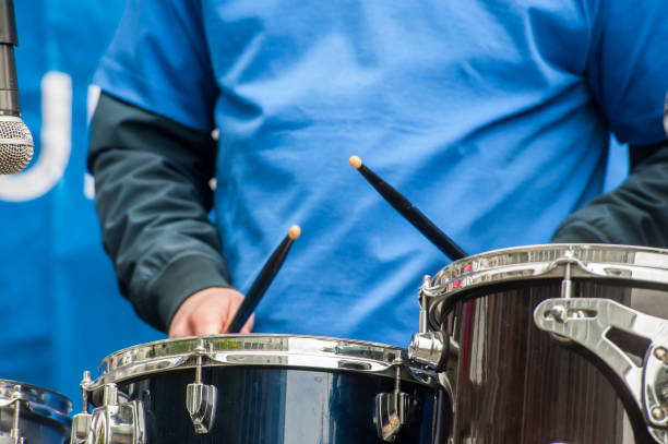 istock drum, detail of playing a musical instrument 1168154202