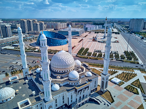Beautiful panoramic aerial drone view to Nursultan (Astana) city center with skyscrapers and Hazrat Sultan Mosque, Astana (Nur-Sultan or Nursultan), Kazakhstan (Qazaqstan)