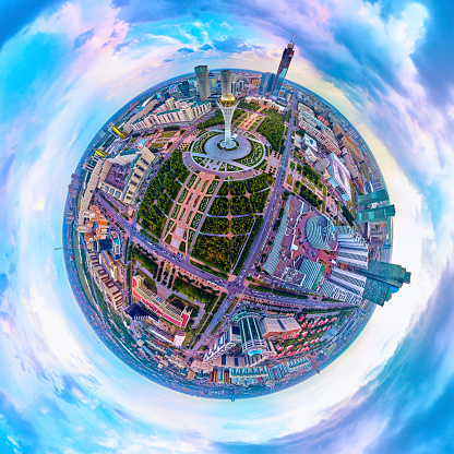 Beautiful panoramic (360 spherical panorama little planet) aerial drone view to Nursultan (Astana) city center with skyscrapers and Baiterek Tower, symbol Kazakh's people freedom - The monument represents the idea of the Kazakh people about the universe. According to legend, Baiterek is the tree of life, to which the sacred bird Samruk aspires. Astana (Nur-Sultan or Nursultan), Kazakhstan (Qazaqstan)