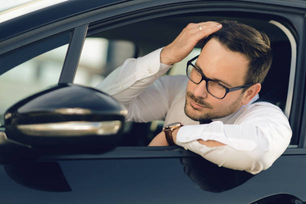 istock Businessman checking hair at side view mirror 1168160400