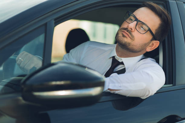 istock Businessman driving a car 1168160426