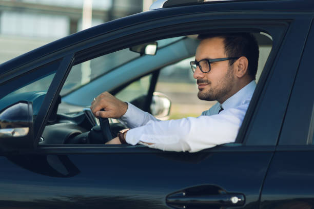 istock Businessman driving a car 1168160534