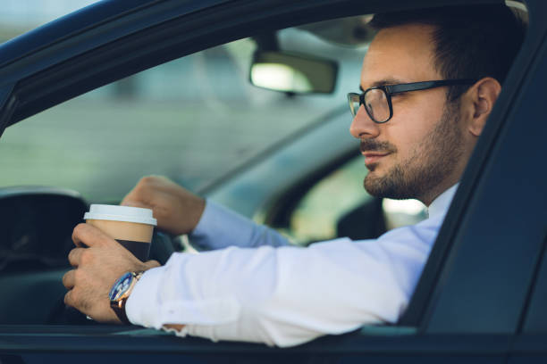 istock Businessman driving a car 1168160585