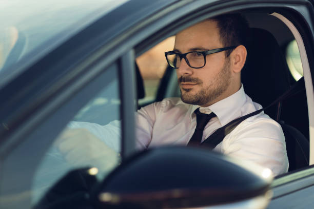 istock Businessman driving a car 1168160760