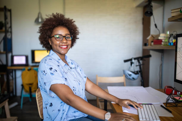 istock Smiling Afro female graphic designer at work 1168160827