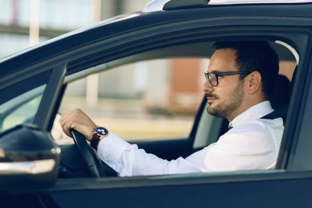 istock Businessman driving a car 1168160858