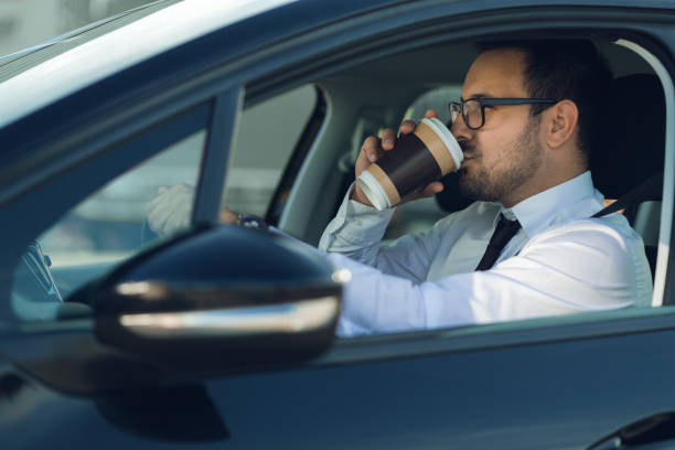 istock Businessman driving a car 1168160899