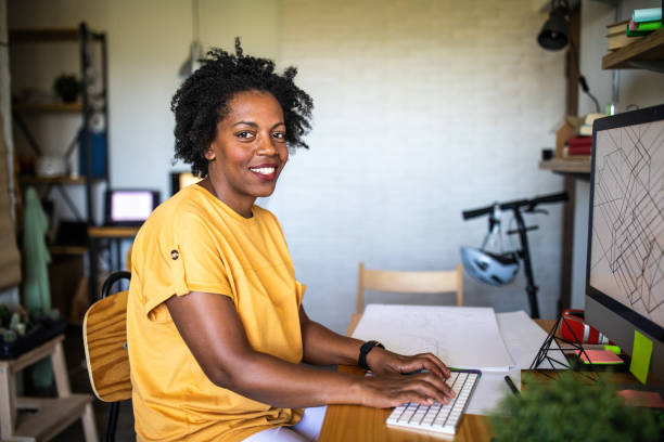 istock Joyful female architect working in the office 1168160928